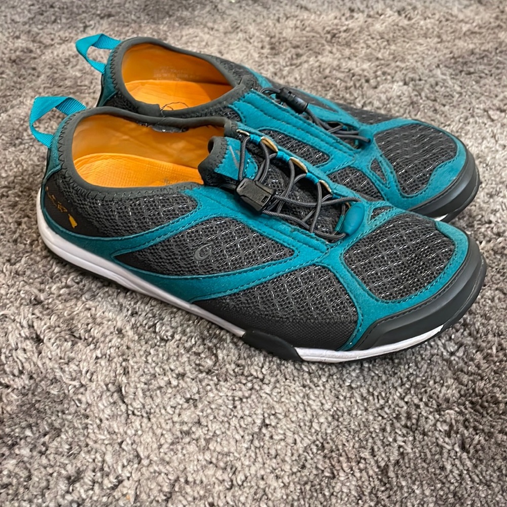Black and Aqua Olukai sneakers